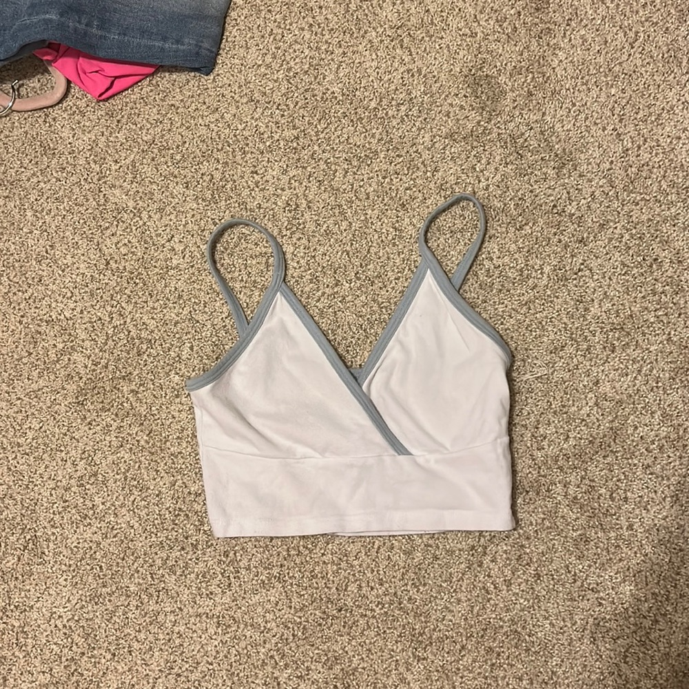 white and blue john galt crop tank